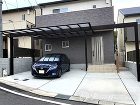 モダンで使いやすい外まわりにリフォーム ... 梁延長のカーポートで一体感のあるエントラ...