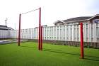 愛知県小牧市にてリフォーム外構工事。裏庭に人工芝を設置し、赤フレームの鉄棒施工、家庭菜園用の空間も設計しました。