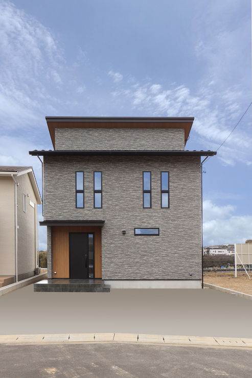高台から市街地を一望できるロケーションに建つ落ち着きあるフォルム 画像