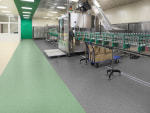 Bottles with vodka on the conveyor. Production and bottling of alcoholic beverages.